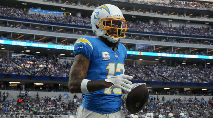 Chargers wide receiver Keenan Allen holds onto a ball in a game.